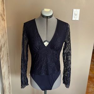 This navy blue sheer bodysuit is from Shein and is super cute!